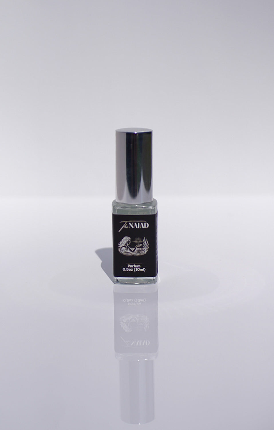 The Naiad 15mL Perfume bottle with silver cap and black label on a white background