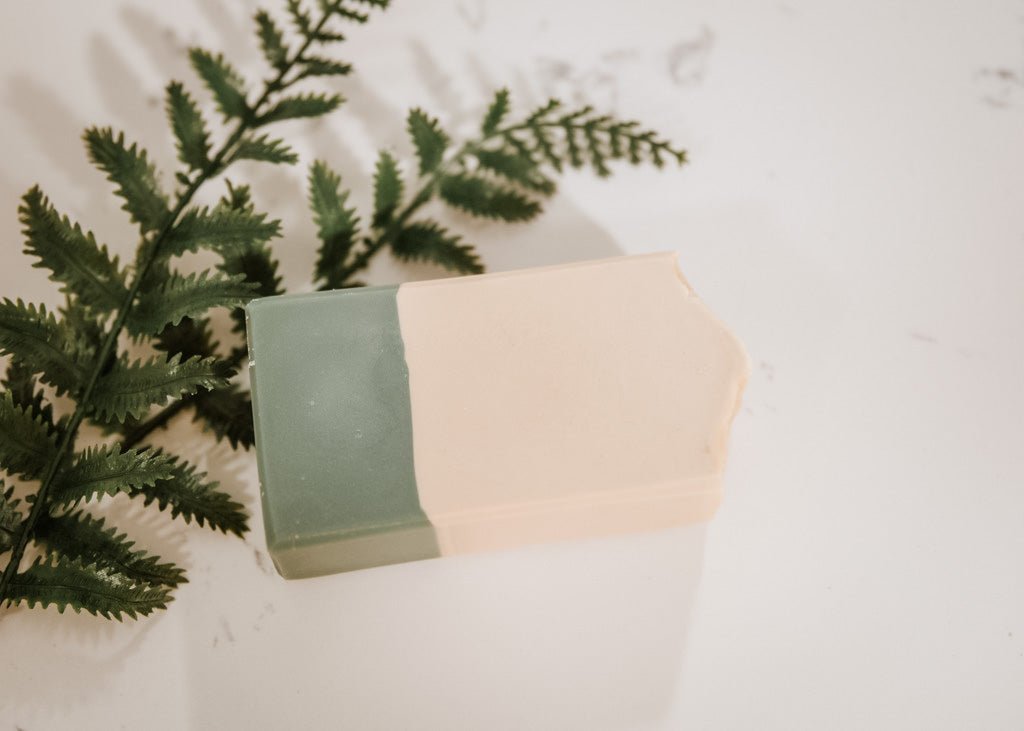 Handmade cold process goat milk soap bar by Flicker & Twinkle – two-tone green and cream design, eco-friendly and nourishing skincare.