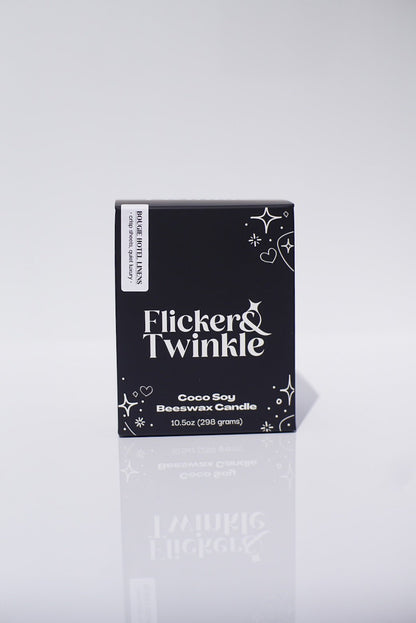 A black box labeled Bougie Hotel Linens Candle - Coconut Soy Beeswax, 10.5oz, fresh linen scent.
