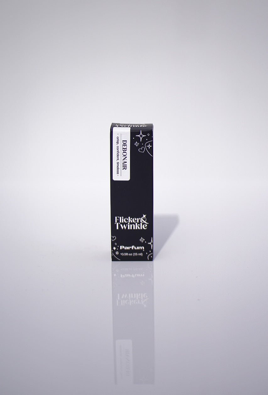 A small, upright black box labeled Debonair Parfum, a luxury fragrance, on white background.