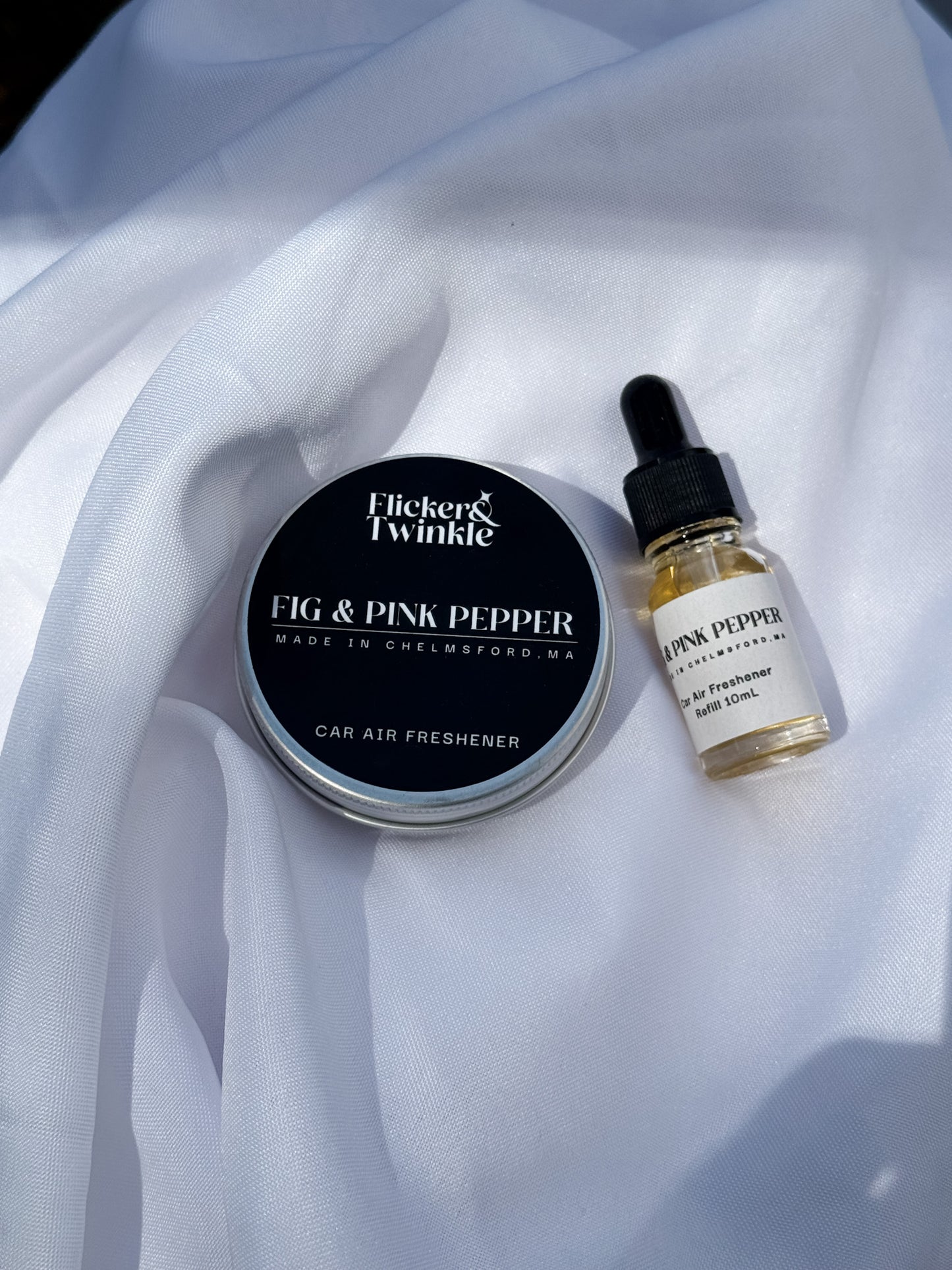 Fig and Pink Pepper Car freshener and refresher refill on a white sheet