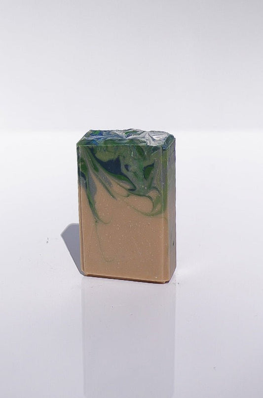 Havenwood Goat Milk Soap: a rectangular handmade bar with green and blue swirls on top.