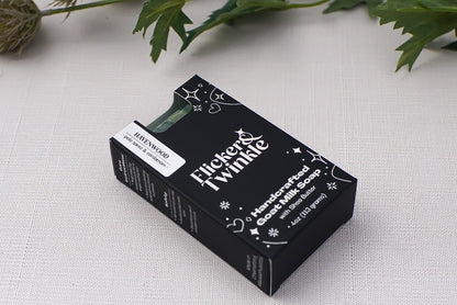 A black box of Havenwood Goat Milk Soap rests on a light fabric surface.