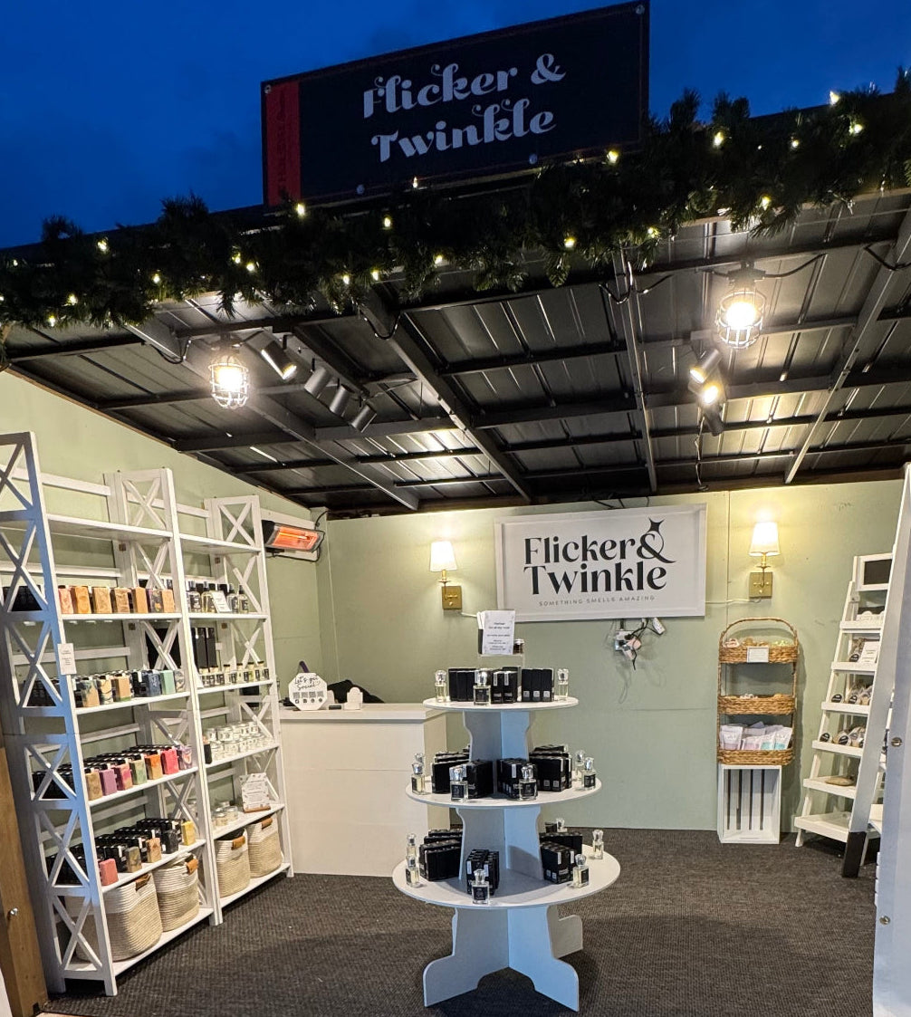 Store interior with 'Flicker & Twinkle' branding, shelves, and products.