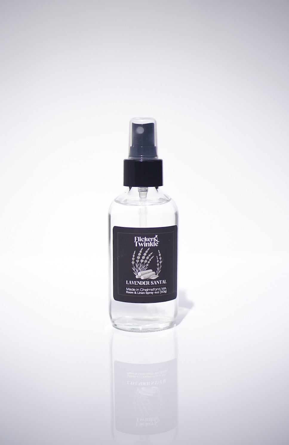 Clear Lavender Scented Room and Linen spray bottle with black cap and label on a white background