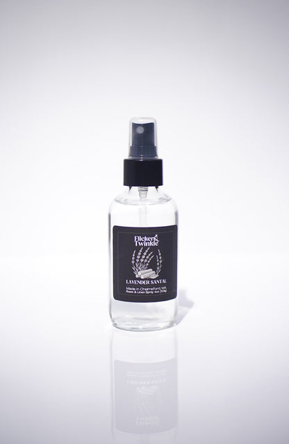 Clear Lavender Scented Room and Linen spray bottle with black cap and label on a white background