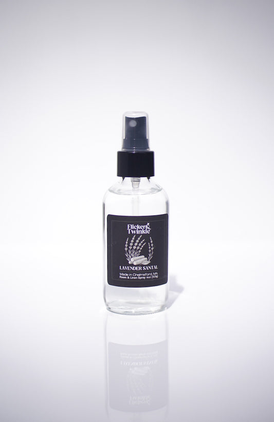 Clear Lavender Scented Room and Linen spray bottle with black cap and label on a white background