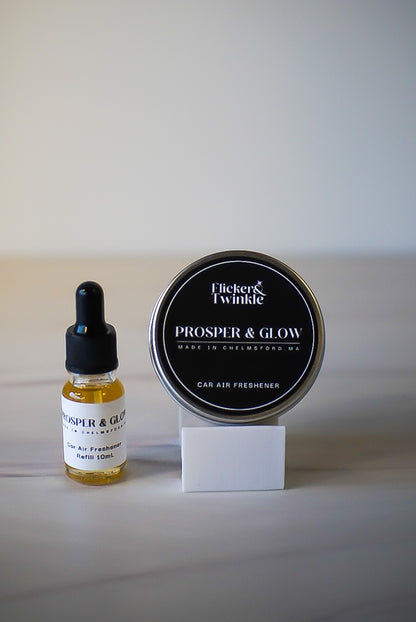 Flicker & Twinkle Prosper & Glow car air freshener bottle and container on a white background