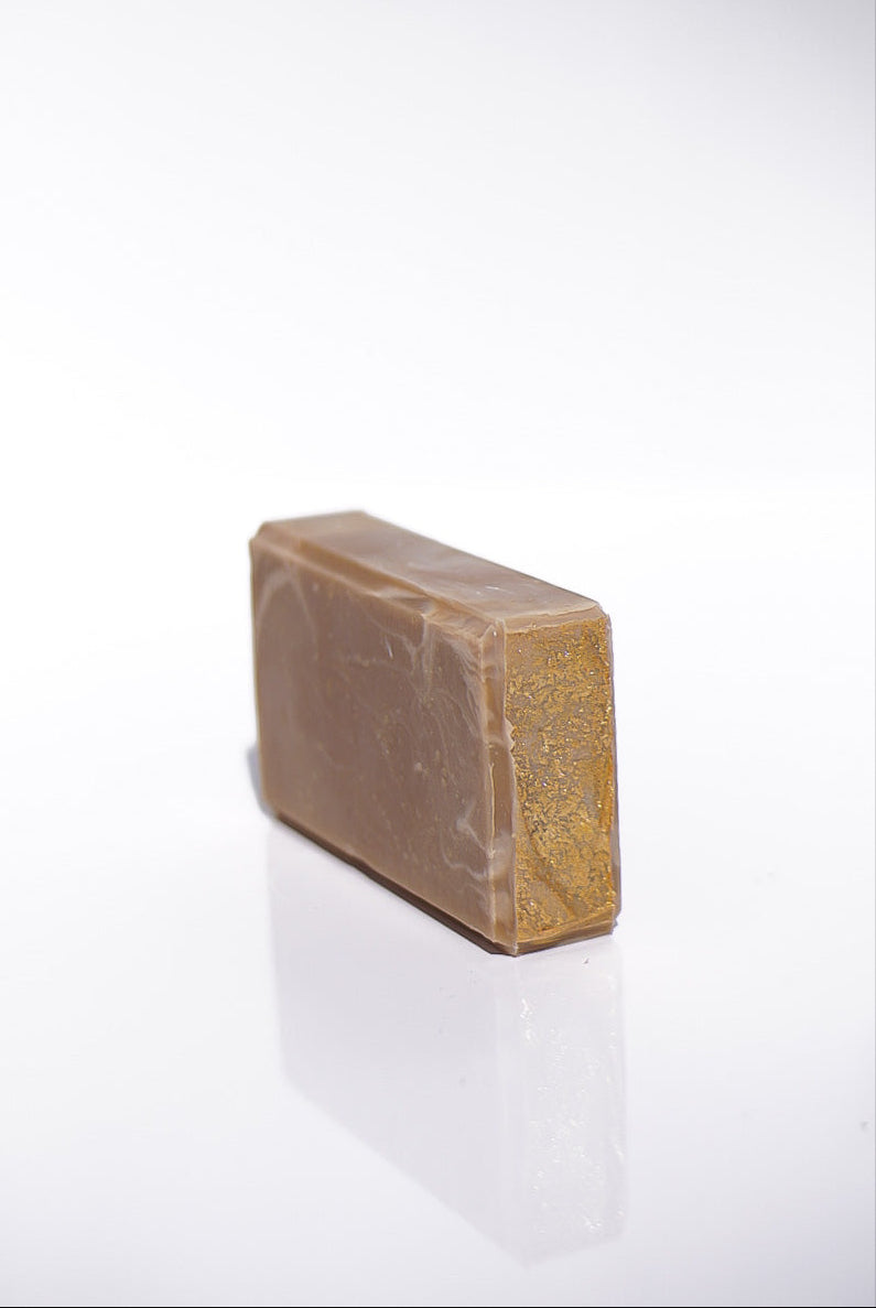 Bar of soap on its side a white background