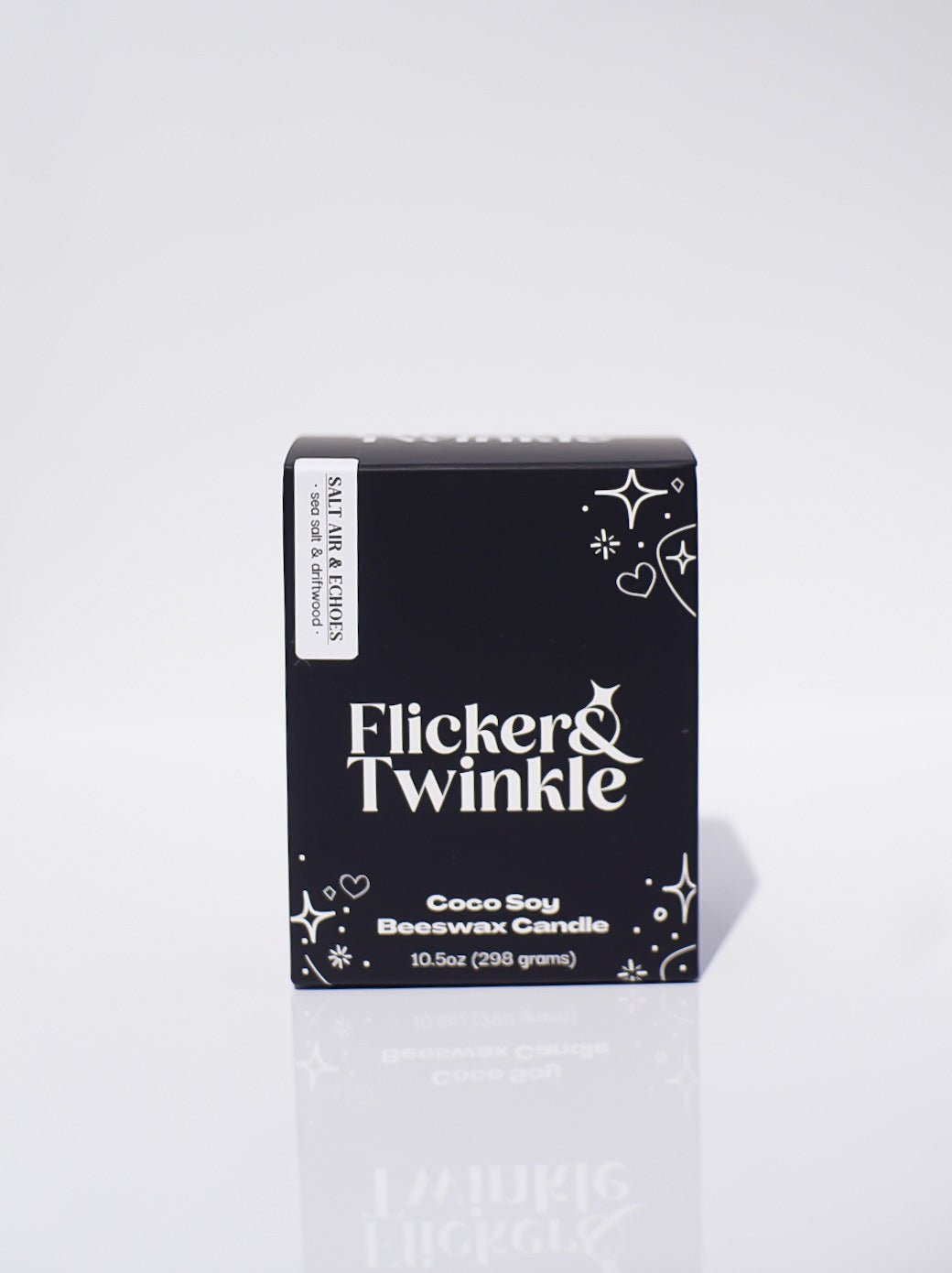 Black box labeled Salt Air & Echoes Candle- Coconut Soy Beeswax 10.5oz on white background.