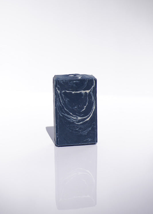 navy Blue and white marbled soap against a white background