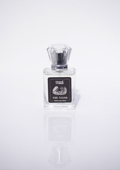 Perfume bottle labeled 'The Naiad' on a white background