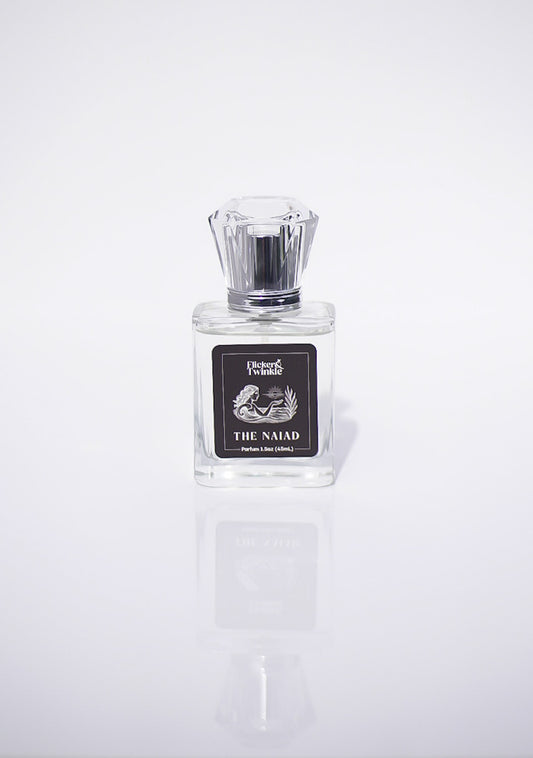 Perfume bottle labeled 'The Naiad' on a white background