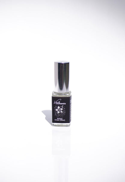 A small glass bottle of Vanille Enchantée Perfume with a silver cap on a white background.