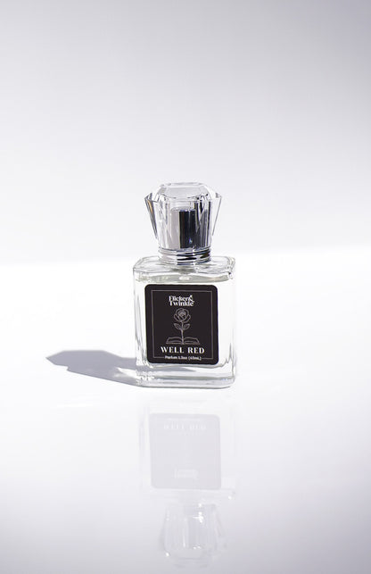 Perfume bottle labeled 'Well Red' on a white background