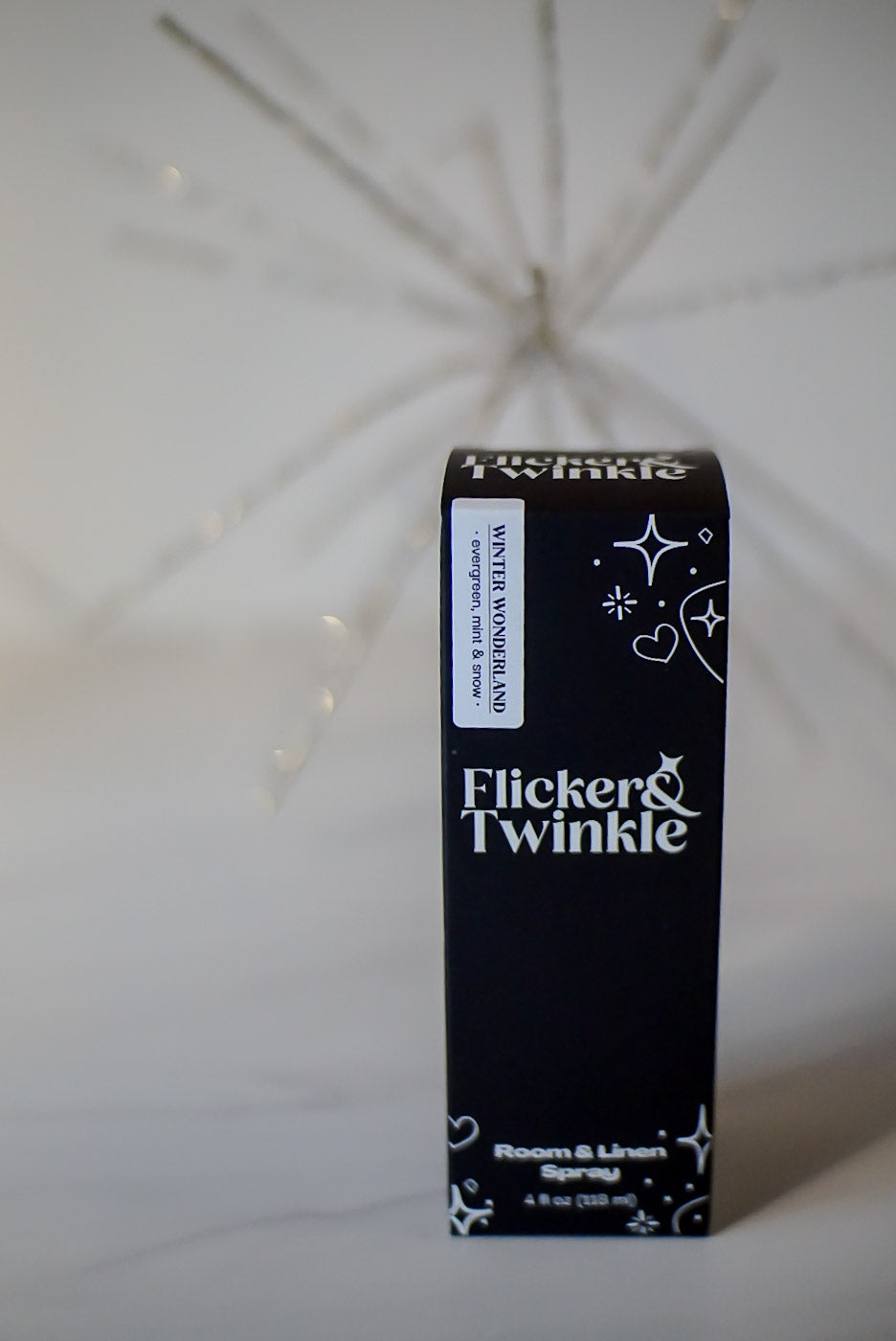 Flicker & Twinkle holiday room spray black boxed packaging on a white background