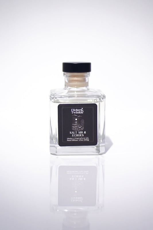 Salt Air & Echoes Reed Diffuser in a glass bottle with black label, on a white background.